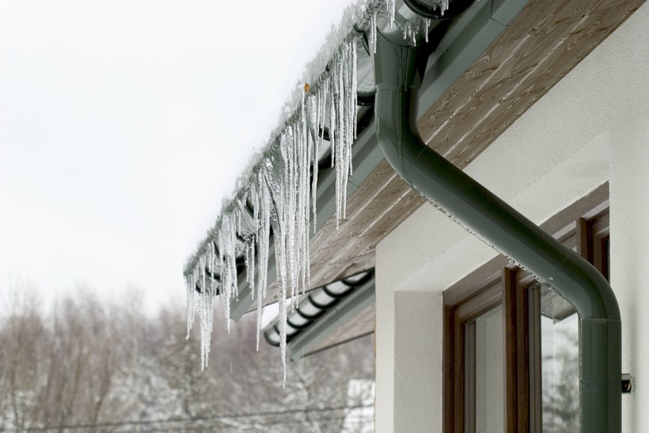 Icicles hanging from the roof of a house